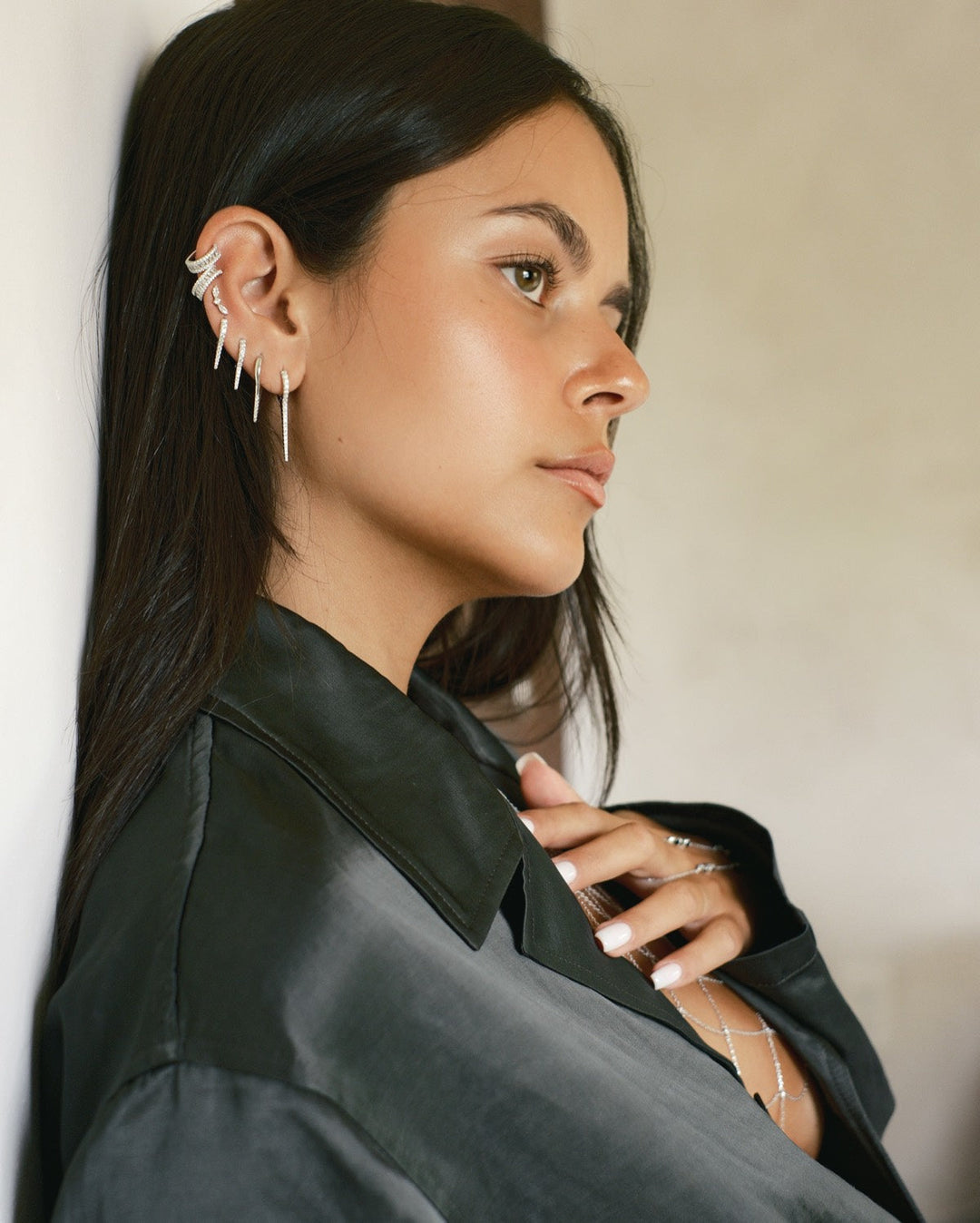 Silver baguette ear cuff worn on the upper outer edge of the ear, no piercing needed